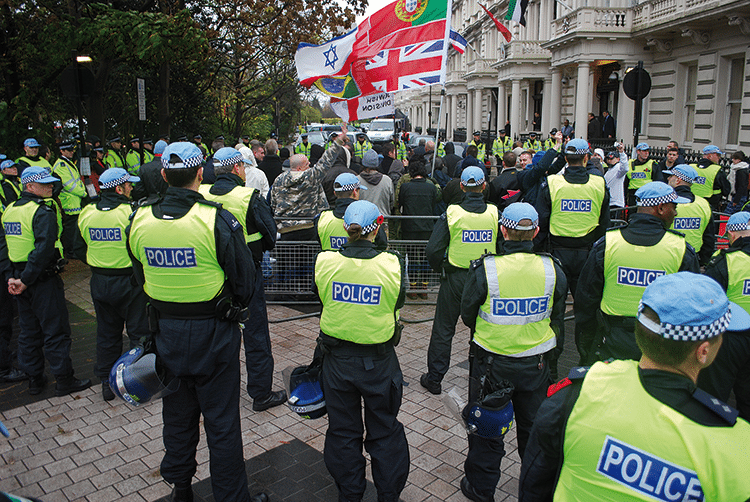 Police stand watch as EDL and MAC supporters gather on remembrance day, 11th November 2010