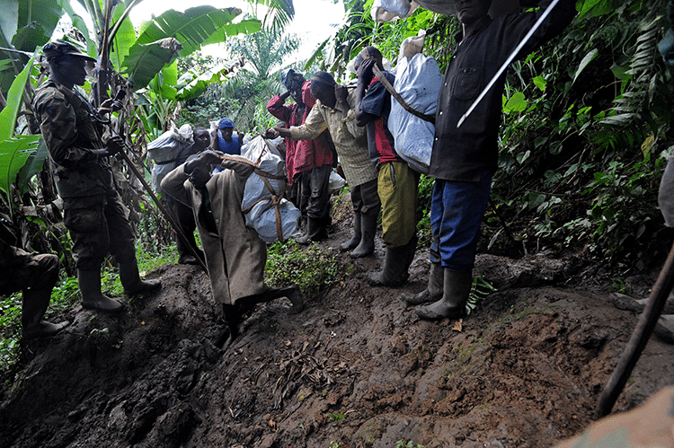 RDF troops walk through the remote reaches of Walikali district, which is also inhabited by FDLR fighters