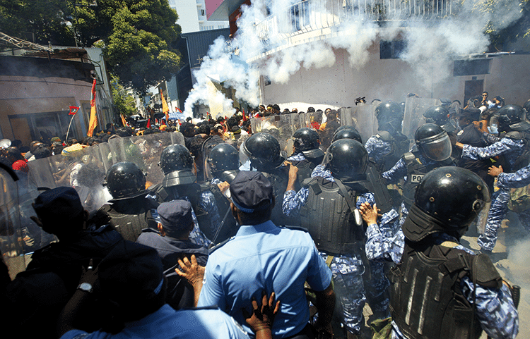 Nasheed's supporters are confronted by riot police, 19th March 2012. Photo: Sinan Hussain/AP/Press Association Images