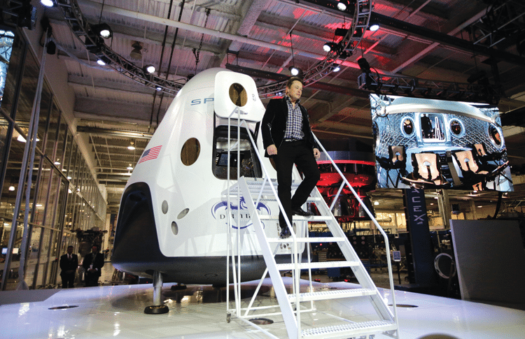 Elon Musk and his commercial Dragon V2 capsule. Photo: Jae C. Hong/AP/Press Association Images