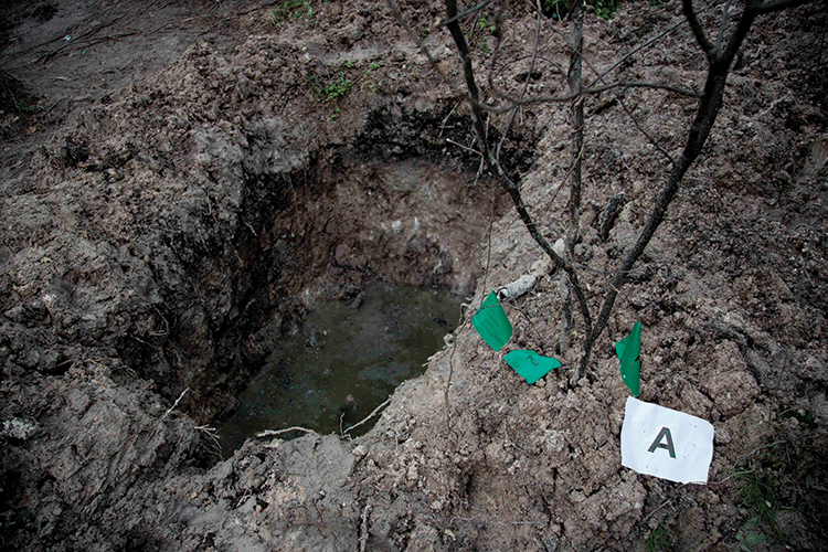 A clandestine grave in Iguala uncovered as officials worked to determine whether 28 bodies found at the site were those of the students abducted in September 2014. Photo: Marco Ugarte/AP/ Press Association Images