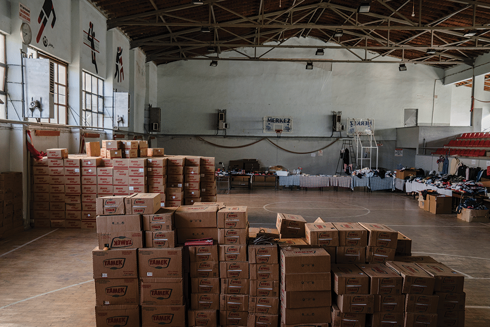 Donations of food, clothing and other household goods are stored at Soma’s municipal sports complex, ready for distribution to miners’ families. Photo: Guy Martin