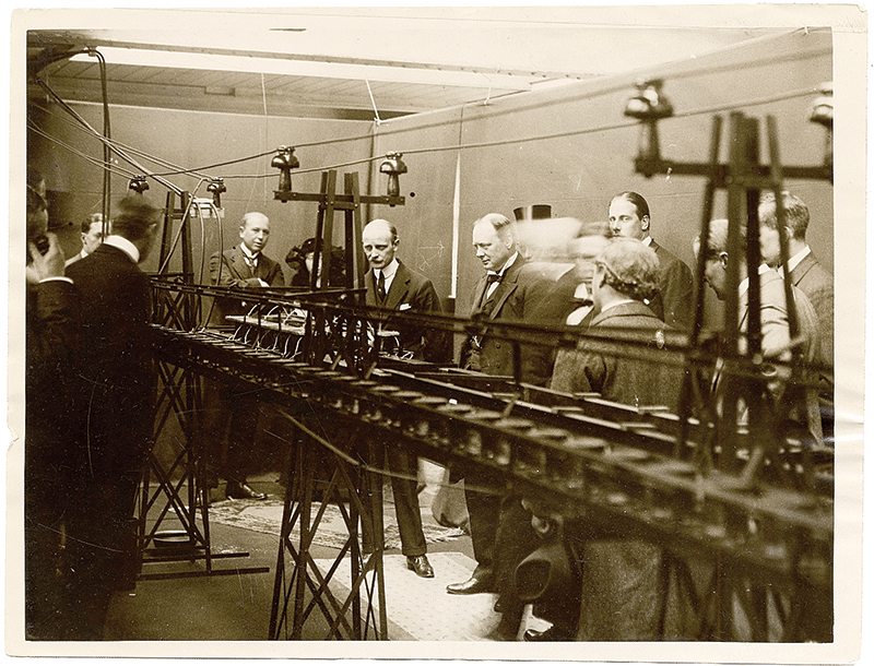 1914: Emile Bachelet demonstrates the first working model of a magnetic train to Winston Churchill in London