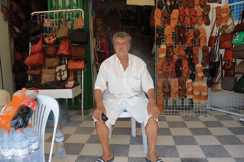 Boubakar Ajmi in front of his shop