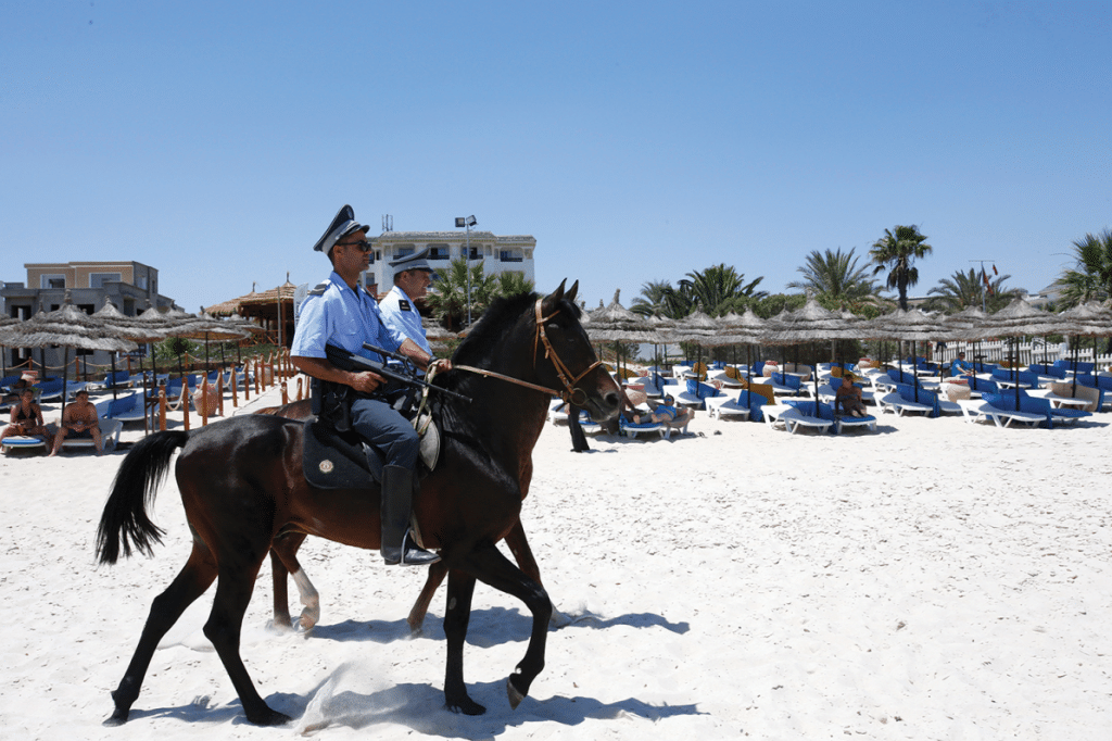Mounted police officers patrol the beach of Sousse, Tunisia on Sunday June 28, 2015. Photo: Abdeljalil Bounhar/AP/Press Association Images