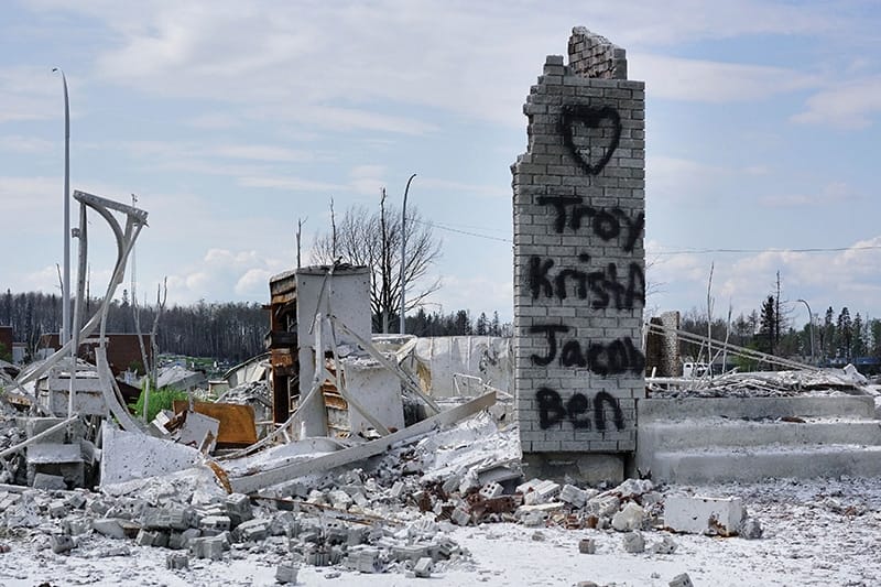 A lone wall left standing in the Abasand district has been graffitied with a tribute