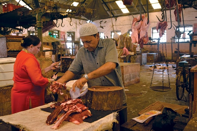 A butcher prepares meat for sale at Mumbai’s Crawford Market. Photo: Vidhi Doshi