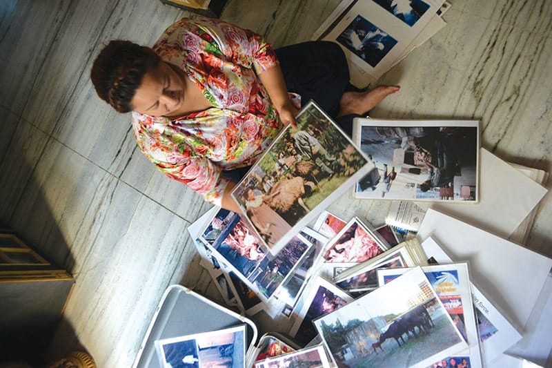 Shaheen Qureshi shows some of the reports and photographs her family has kept to document the work of beef bootleggers. Photo: Vidhi Doshi