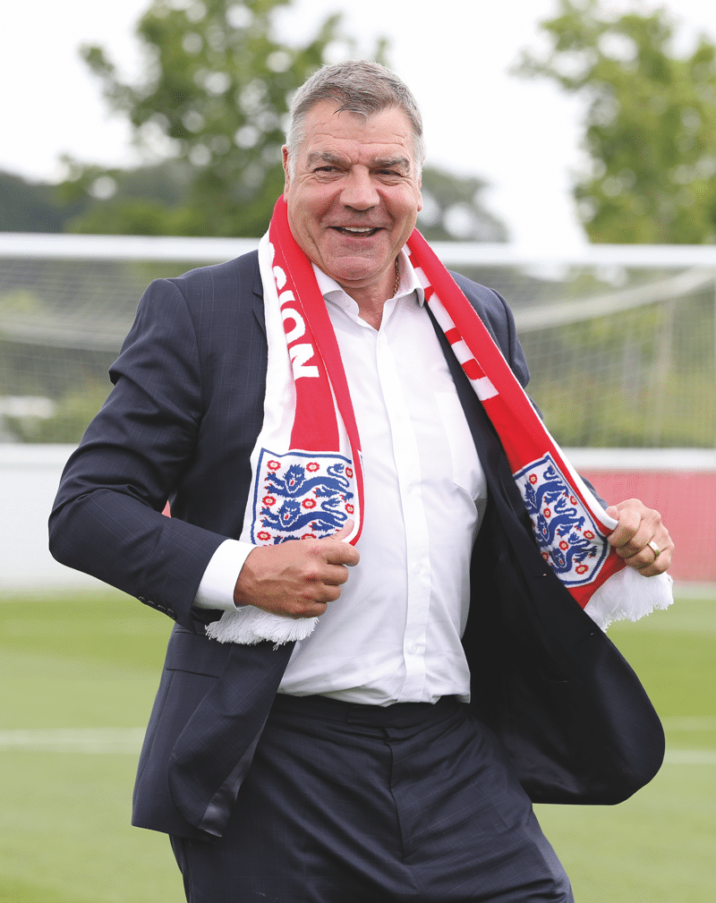 Poses with an England scarf on 25th July 2016, the day he was unveiled as England manager. Photo: artin Rickett / PA Wire / PA Images