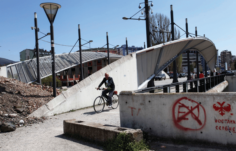 The bridge between ethnic-Albanian-dominated southern Mitrovica and the Serb-majority northern part of the city, April 2013. Photo: Zveki / AP / PA Images
