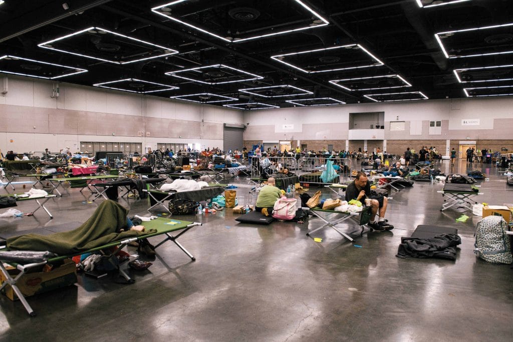 People escape the extreme heat at the Oregon Convention Center cooling station in Portland, Oregon, on 27th June.