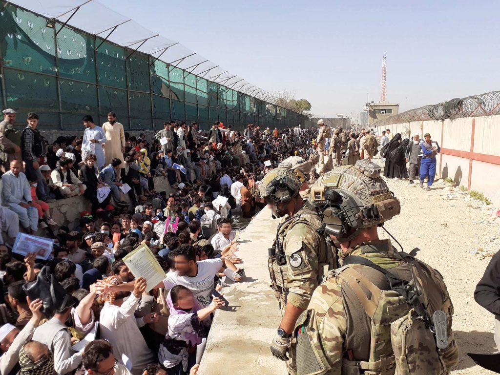  New Zealand Defence Force soldiers watch over crowds at the airport in Kabul