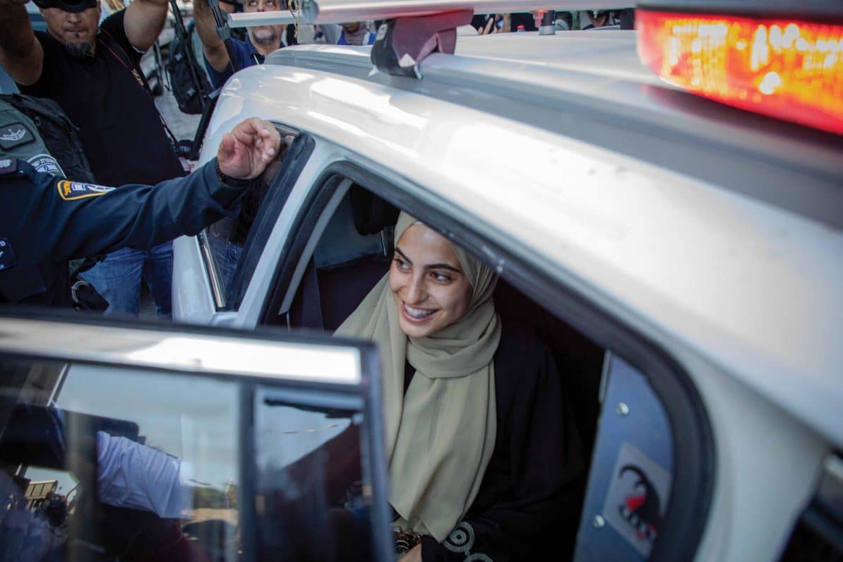 Muna el Kurd smiles while being detained by Israeli police, 6th June 2021