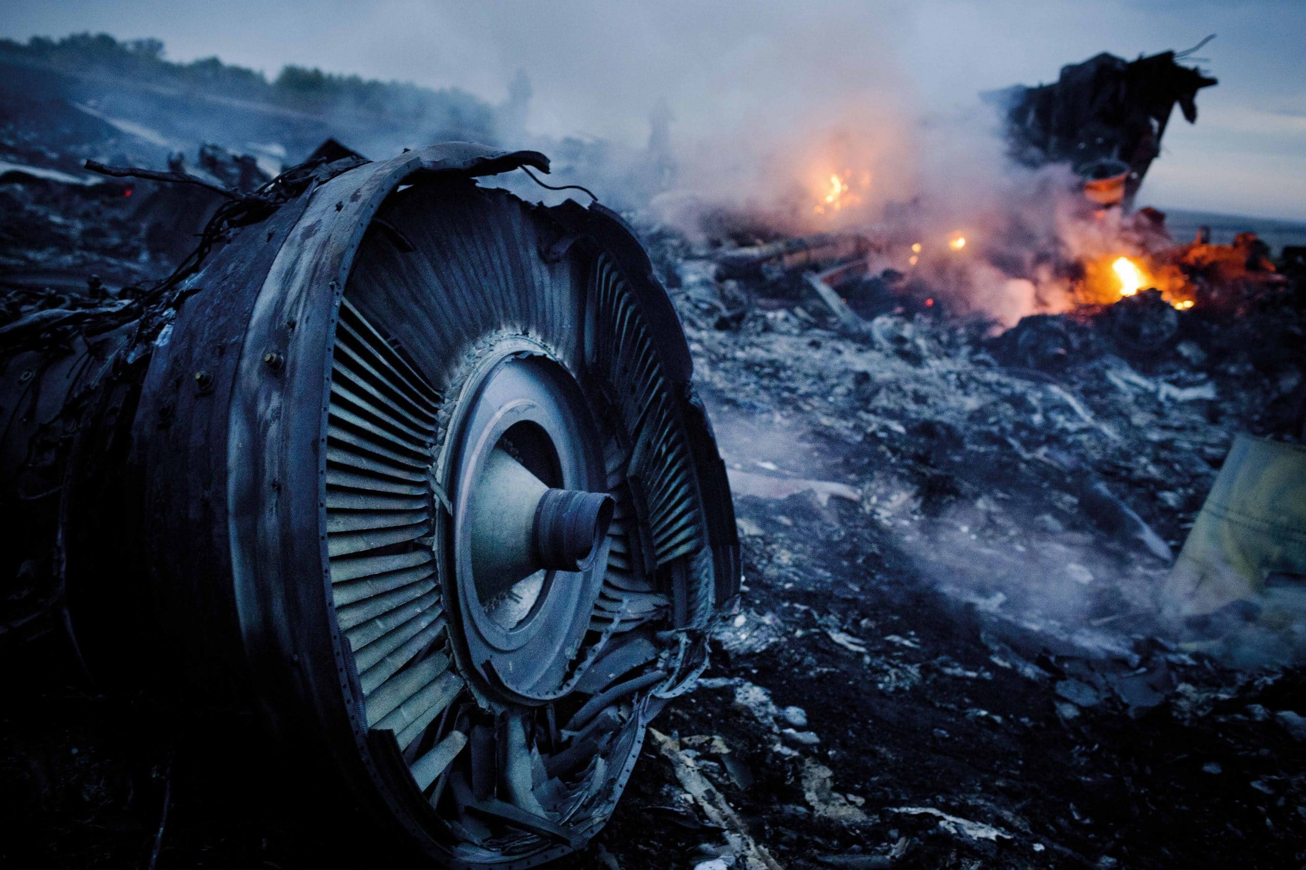 Debris from the downed plane smoulders in a field in Hrabove in the Donetsk province, 17th July 2014