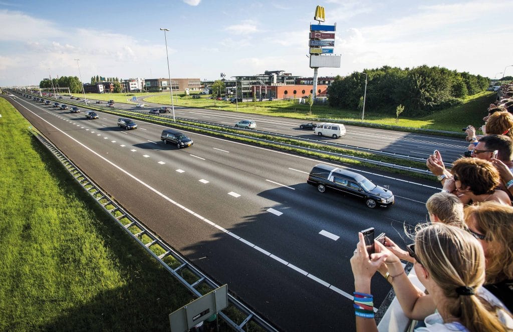 A procession of hearses carries the remains of the victims of the crash from an airbase in Eindhoven to Hilversum in the Netherlands, 24th July 2014