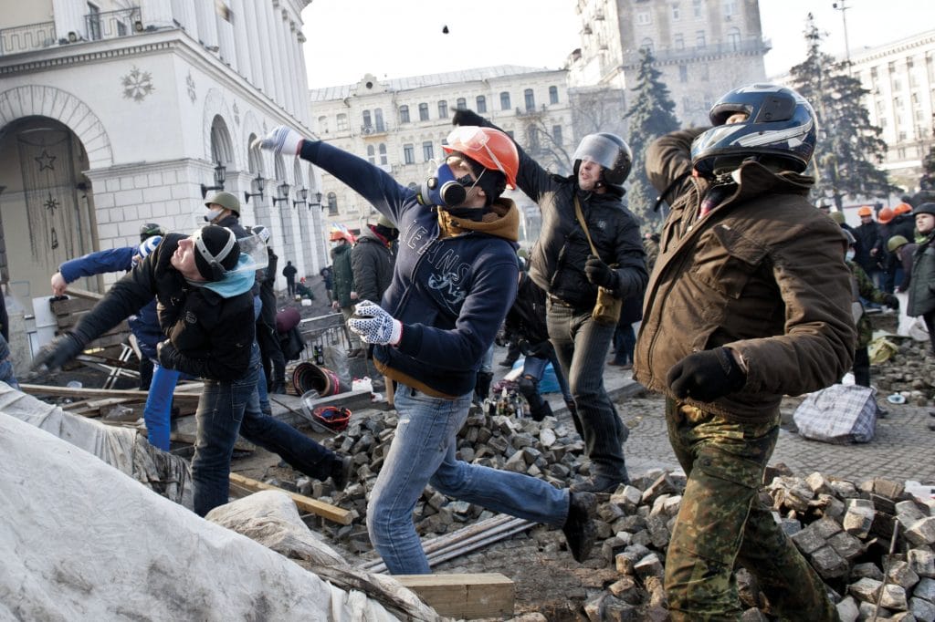 Anti-government protesters clash with police in Kiev in February 2014 