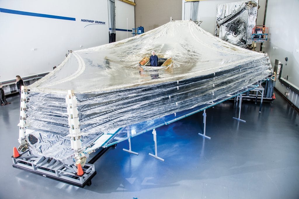 Mark Clampin standing in a full-scale test article of the sunshield on the Webb telescope, 22nd July 2014