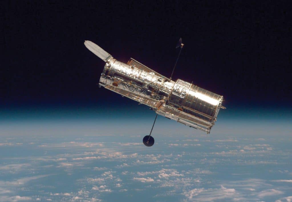  The Hubble Space Telescope orbits Earth in 1997; Webb will be 100 times more powerful than its predecessor