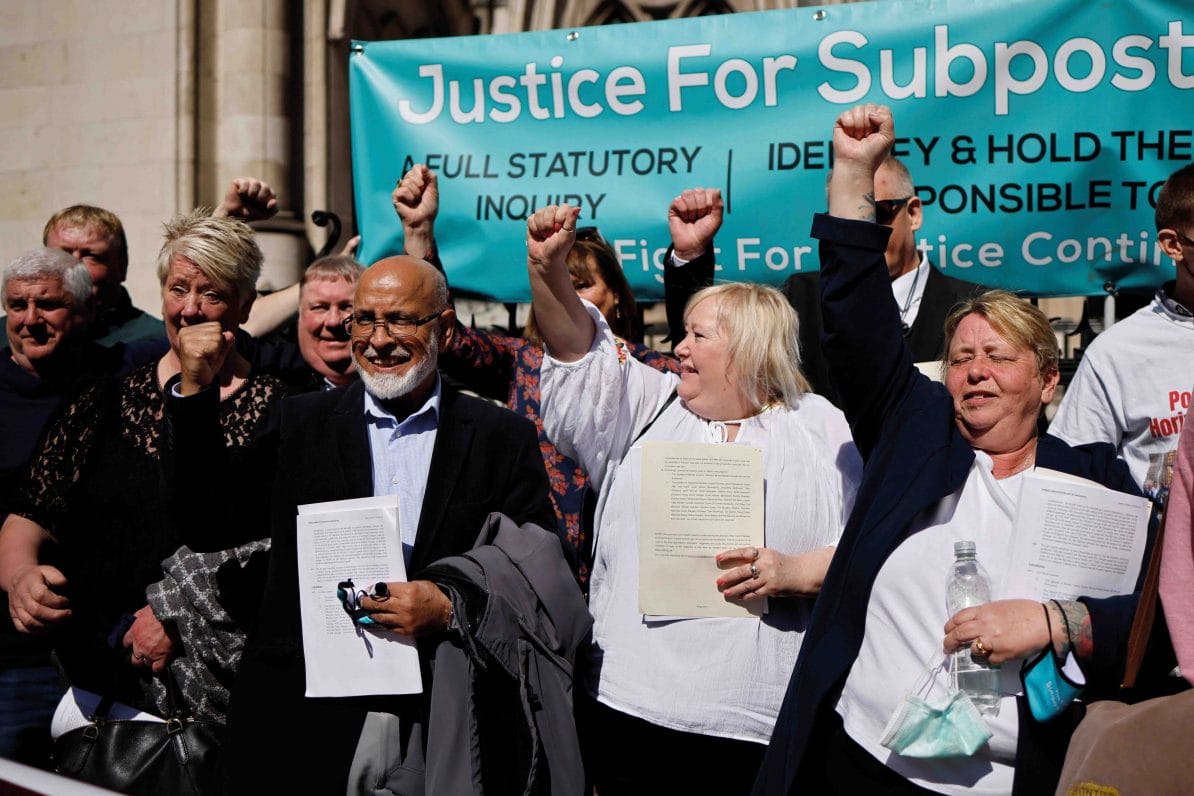 Former subpostmasters celebrate outside the Royal Courts of Justice in London, following a court ruling clearing them of convictions for theft and false accounting, 23rd April 2021
