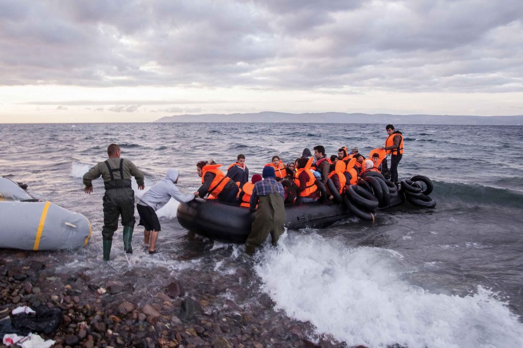  A boat of refugees and migrants arrives in Greece in October 2015. The United Nations estimates that more than one million people fled to Europe in 2015, half of whom were Syrians escaping the war in their country