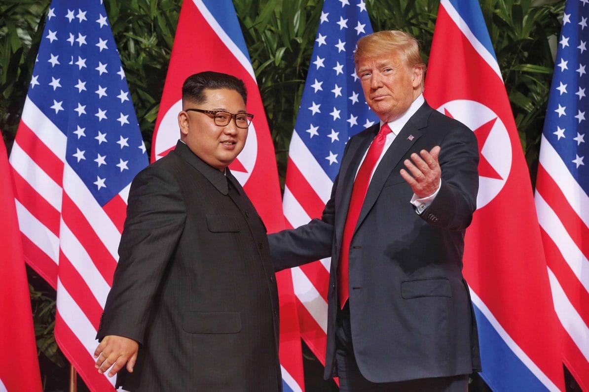President Donald Trump and Kim Jong-un pose for photos at the US-North Korea summit in Singapore, 12th June