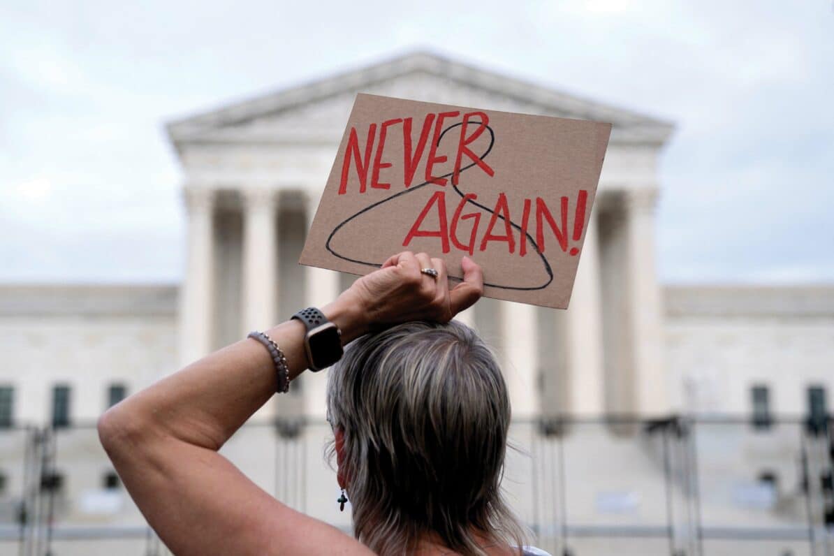 A pro-choice demonstrator holds a sign in front of the US Supreme Court in Washington, DC in May ahead of its ruling on the landmark Roe v Wade case