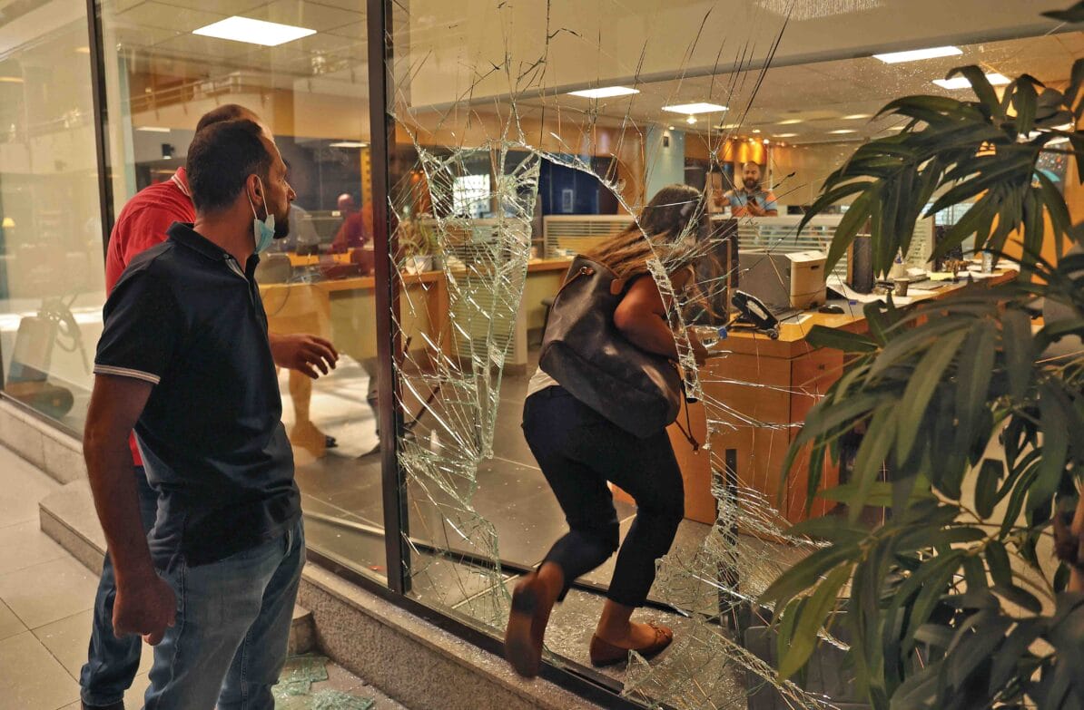 The window of Blom Bank in Beirut is left broken after Sally Hafiz storms the branch to demand access to her family’s money, 14th September 2022
