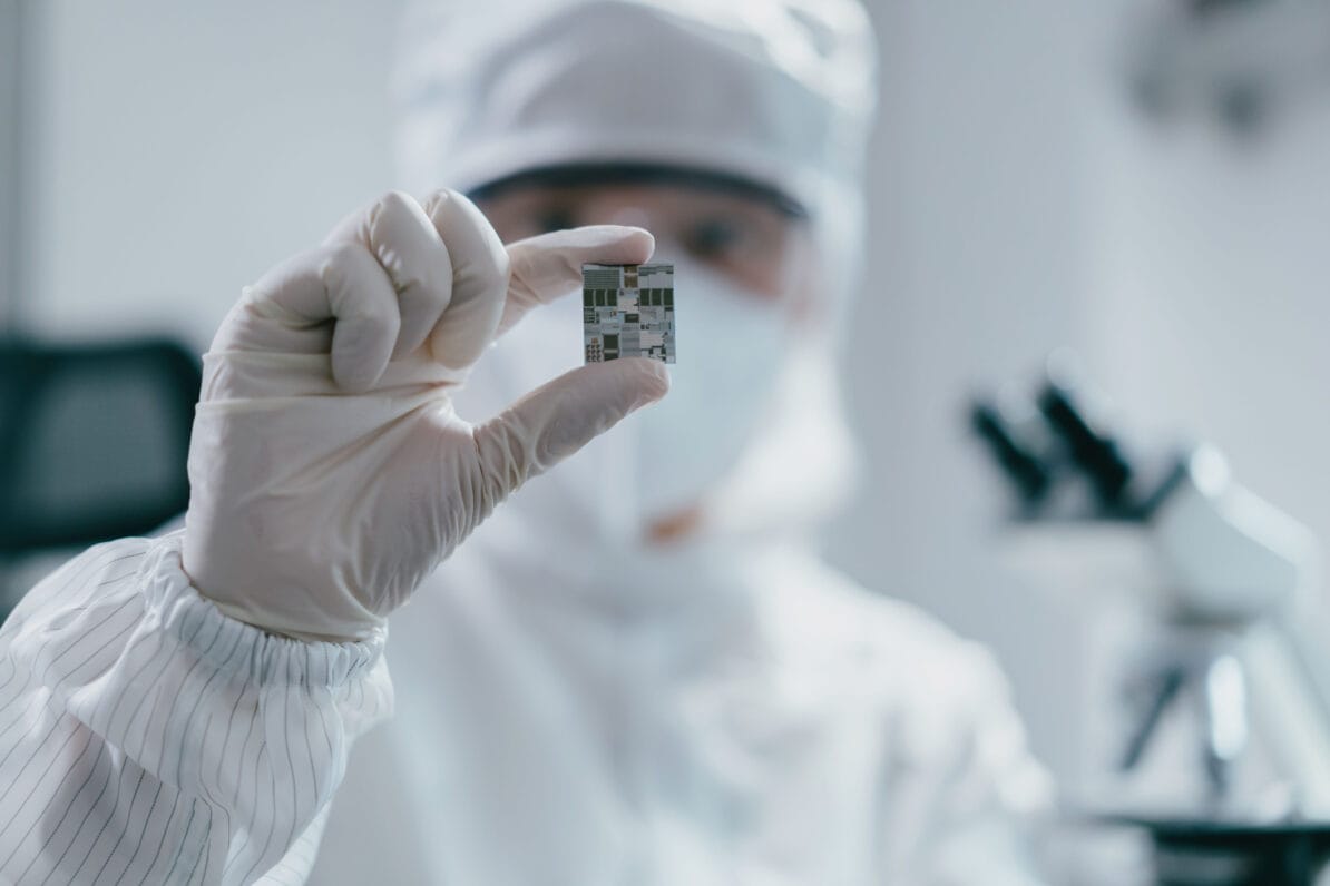 An engineer holds up a microchip in a semiconductor foundry. Nations which control the most cutting-edge chips will enjoy potentially huge commercial and military advantages