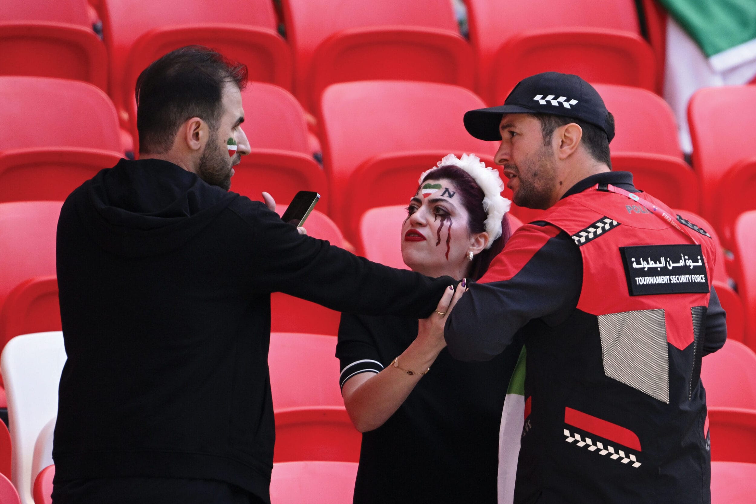 A member of security staff contronts fans at the Wales-Iran match, 25th November 2022
